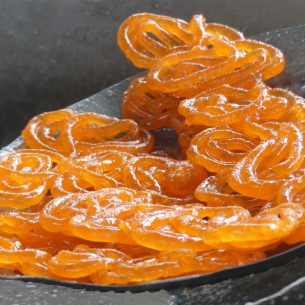 Fresh Crispy Hot Jalebi delivered at your doorstep by StreetFood.com, featuring Ruby Herbal Pharma’s support.